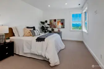 Fourth bedroom with mountain views, ensuite bath.