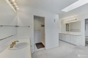 Primary Bath w/separate vanities & basins; toilet & shower behind door (center)