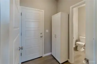 Mud room off garage with pantry and 1/2 bath