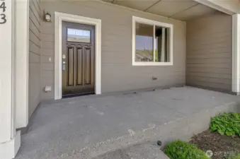 Large covered front patio and entrance