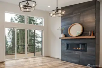 Extra windows for more view and more light.   Slate look fireplace with propane fireplace.