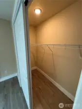 almost walkin closet with light.