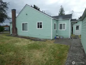 Garage, shed and rear side of house.