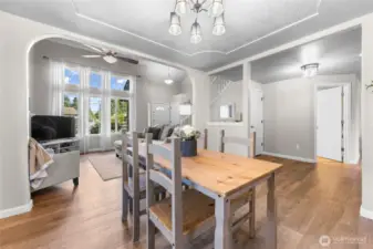 Dining opens to living and kitchen