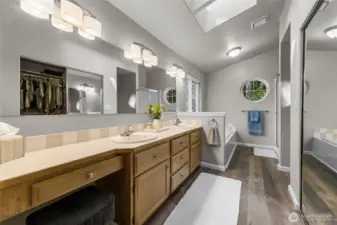 Primary bath with double sinks, soaker tub, walk-in shower and walk-in closet