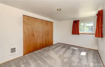 Primary bedroom.  Hardwood underneath.