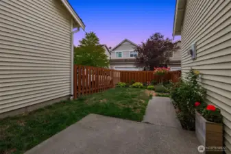 Side yard with garden and new fence.