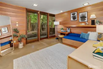 Second bedroom with glass doors to garden space