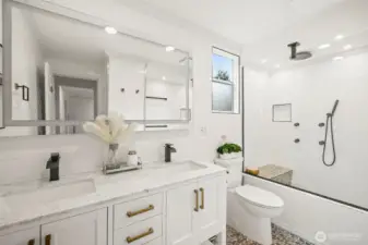 Second bathroom on top floor with dual sink vanity