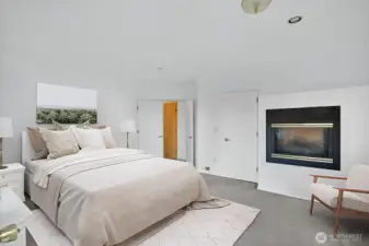 Spacious Primary Bedroom with fireplace.