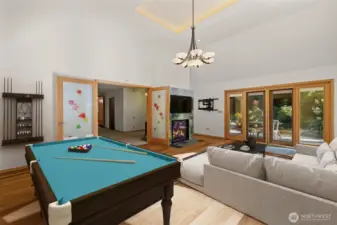 Virtually Staged- Family Room. French doors Lead to Private Outdoor Oasis.