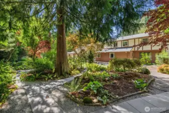 Lush Garden Pathways and Artful Plantings Throughout