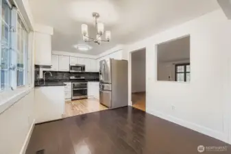 Dining area off updated kitchen features engineered hardwoods and new lighting fixture. Space can accommodate up seating for up to 6.