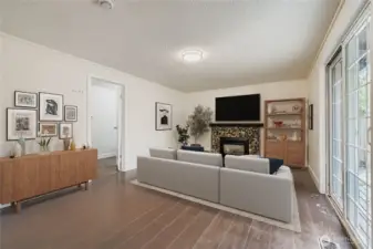 Virtually staged. Family room with gas fireplace, engineered hardwoods, fresh paint and slider to BBQ deck and huge backyard. Adjacent laundry room and 1/2 bath combo.