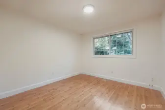 2nd bedroom with large closet, fresh paint, all new lighting and engineered hardwoods.