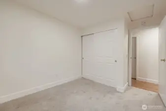 3rd bedroom with brand new carpet, large closet, fresh paint and all new lighting.