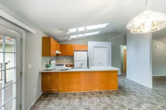 This open kitchen has skylights eating area and and pantry