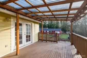 Another view of deck showing French doors that lead to dining area.