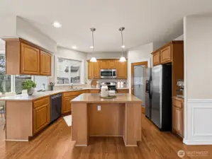 Kitchen open to family room, walk-in pantry.