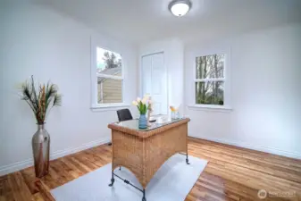 Sunny bedroom with great natural light and a fresh, airy feel.  Also on main floor