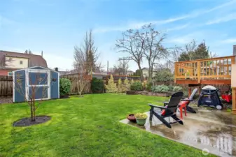 Charming level year with under deck storage for and a stage shed.