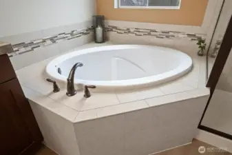 Generously sized soaking tub.