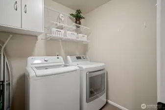 Laundry room on the upper level with a full sized washer & dryer.