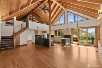 Open floor concept High ceilings and massive windows capture natural light in the dining room and kitchen.