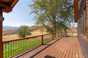 Wrap around deck to sit and enjoy the expansive views.