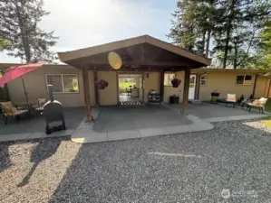 Covered back patio perfect for BBQ, relaxing and having friends & family over!