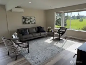 Bright sunny great room with tons of room overlooking the pastures of Bitney Dairy.