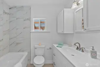 Ta-DAH - brand new tub w/tile shower surround.
