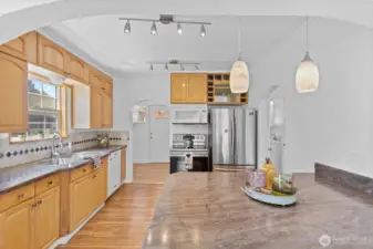 Laminate flooring, tile backsplash, and granite countertops.