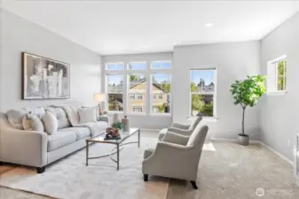 Sun-drenched living and dining room. Really plush carpet throughout. Tall 10 foot ceilings throughout the main level allows for large windows and lots of light.