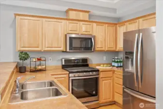 Newer stainless appliances including gas stove are all in pristine condition.