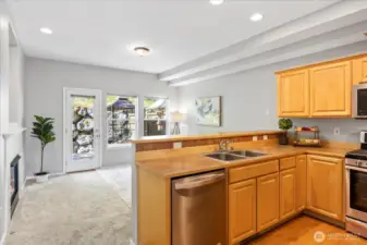 Open concept Great Room off the kitchen makes for another fabulos living space with lots of windows and door to deck.