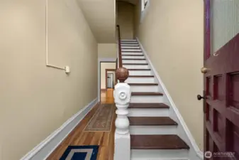 Entry way leads to lower unit (left) and upstairs to upper unit.