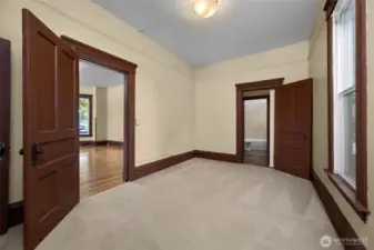 Secondary bedroom has a door leading to living room and to bathroom.