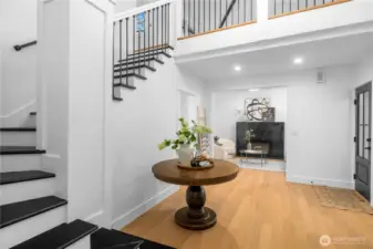 Soaring ceilings with grand staircase