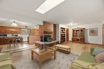 Large living room with wood burning fireplace to sit next too during the cool months and a beautiful focal point in the room.