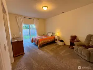 The large primary bedroom features a   walk-in closet, sliding door with access to its own private patio and a beautifully updated bathroom.