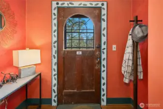 The entry alcove of this 1927 cottage provides a seamless transition into the wonder beyond the door. Be sure to check out the vintage twist doorbell when you visit.