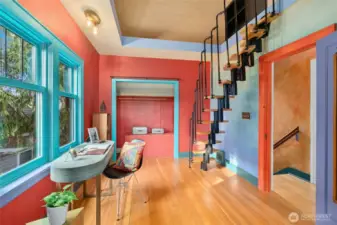 The space-saving DOLLE GRAZ modular staircase leads to a magical loft which maximizes the vertical space, adding to the whimsical, multi-level charm of the living areas.