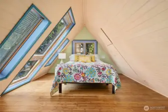 This airy loft provides a wonderful space to sleep, read or meditate among the surrounding trees.