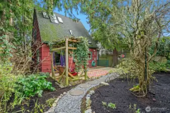 From the tidy alleyway, a secret path unfolds into your own "Secret Garden."