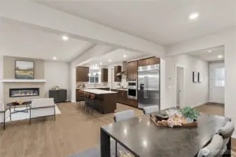 Large great room with spacious dining area adjoining beautifully appointed kitchen and family area. Materials, colors, and finishes will vary. See site agent for details