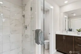 Large walk-in shower with full glass enclosure. Primary bedroom with 5-piece attached bathroom and walk-in closet. Materials, colors, and finishes will vary. See site agent for details