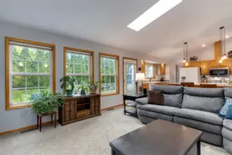 Family room with access to backyard and open to spacious kitchen