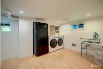 Downstairs laundry room with generous storage.