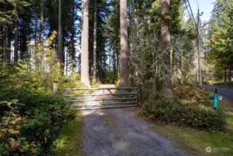 Fenced and Gated Entry. Paved Dead End Rd. Across from NW Trek Property. No Homes! Abundant Trees & Privacy!